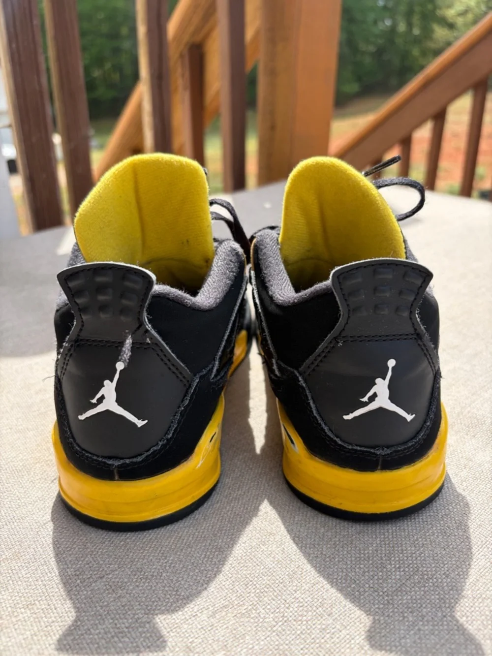 Air Jordan 4 Retro “Thunder” in size 2.5Y GUC.